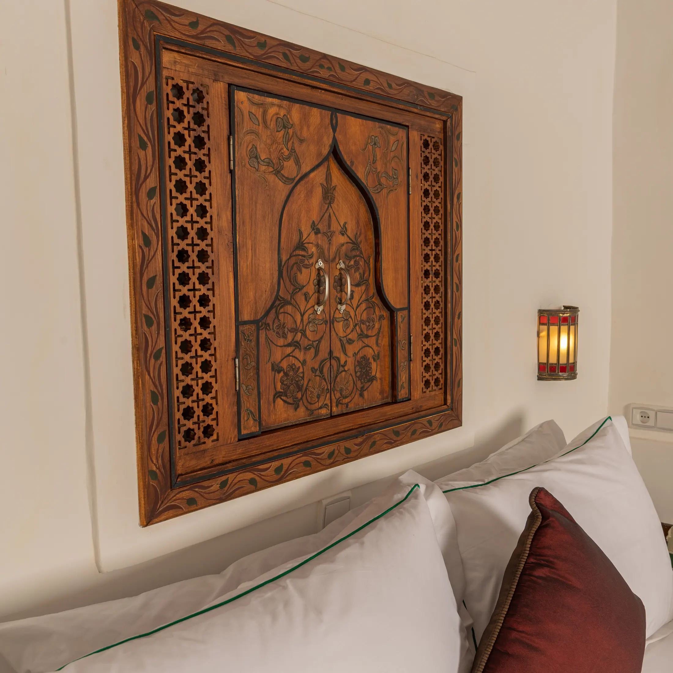 Close view of the carved cedar headboard panel